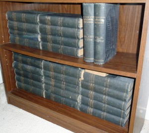 Selling Antique Incomplete Set of Encyclopedia Britannica - volumes on a bookshelf