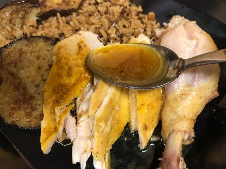 spooning juices on Chicken