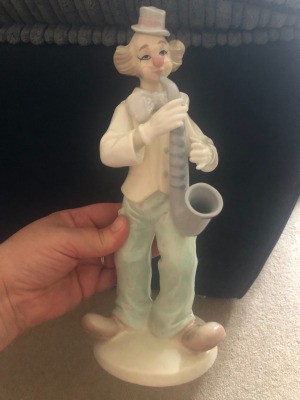 Value of a Leonardo Clown Figurine - muted color sax playing clown