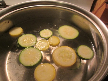Blanching Veggies - sliced squash in pot of water