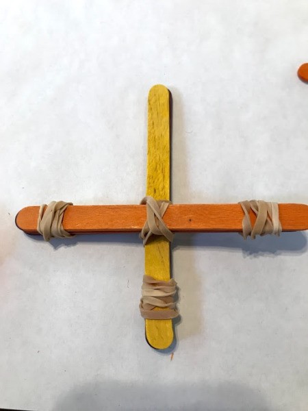 Making a Craft Stick Catapult for Kids - rubber band the two stacks together as shown