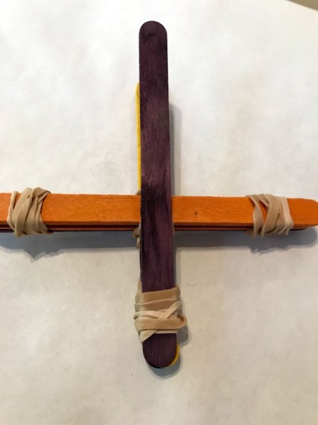 Making a Craft Stick Catapult for Kids - stick banded near the end