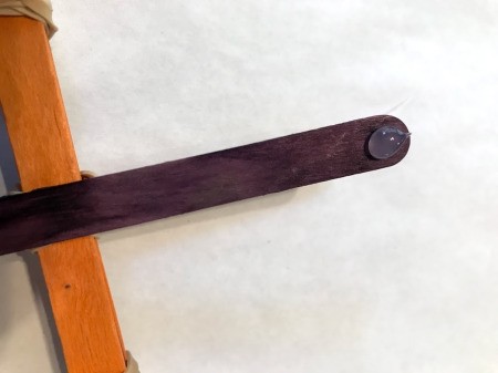 Making a Craft Stick Catapult for Kids - dab of glue