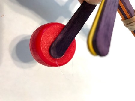 Making a Craft Stick Catapult for Kids - view from the underside