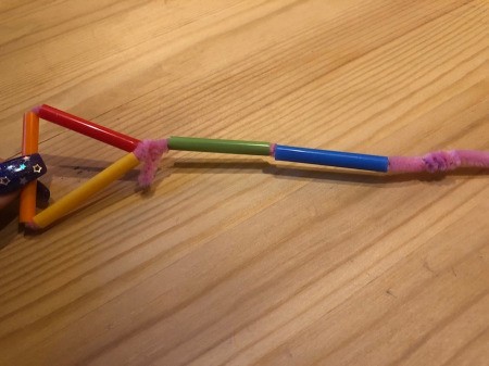 Making Geometric Bubble Wands - slide two pieces of straw onto the pipe cleaner extension