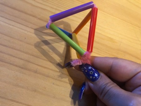 Making Geometric Bubble Wands - pull taut and twist the overhang onto the long pipe cleaner
