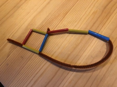 Making Geometric Bubble Wands - push the end of the pipe cleaner into the top of the first square