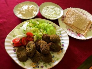 Falafel on plate with sauces & crackers