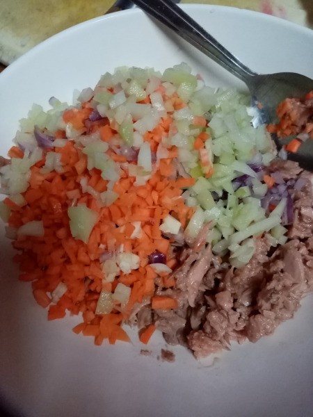 adding fish to mixed vegetables