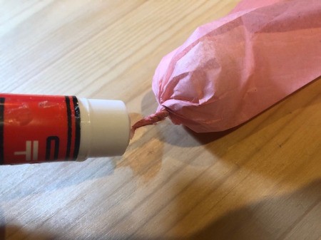 Making Tissue Paper Puffy Flowers - add a bit of glue and twist some more