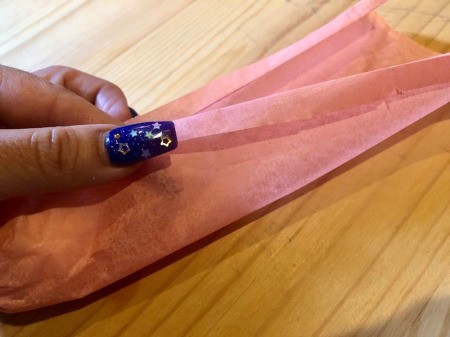 Making Tissue Paper Puffy Flowers - fold two flaps outward to neatly crease
