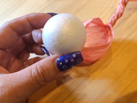 Making Tissue Paper Puffy Flowers - loosen the twist a bit and remove the ball