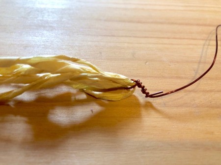 Making Tissue Paper Puffy Flowers- twist the wire to secure the pistils