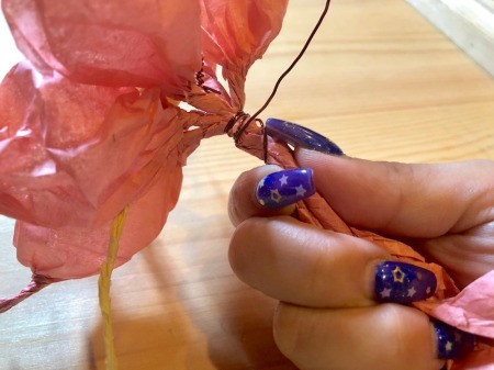 Making Tissue Paper Puffy Flowers - twist the remaining wire around the flower stems, trim pistils and flower ends if desired