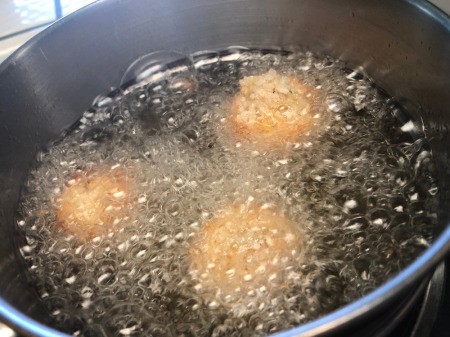 breaded Fritters cooking in hot oil
