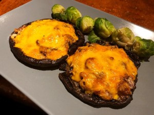 Bacon and Cheese Portobello Caps on plate with brussel sprouts