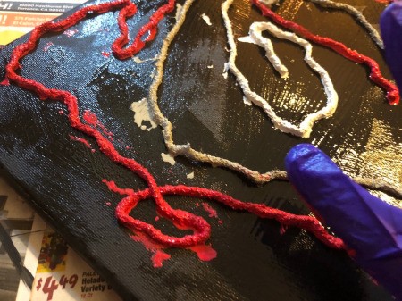 String Pull Abstract Painting - gently tap down on the string to make sure it is sticking to the canvas