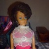 Value of a 1958 Midge Barbie Doll - Midge doll wearing a bright pink dress with a lace top and bouffant hairdo