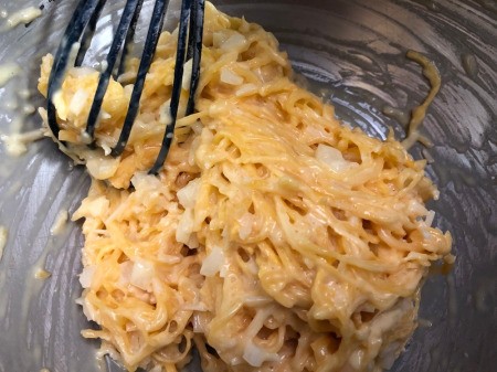 adding Spaghetti Squash & onions to bowl