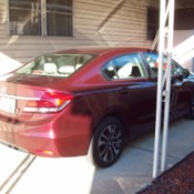 Installing Sunscreen Netting on Aluminum Carport - carport supports and car in background