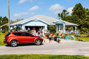 A garage sale in a front yard.