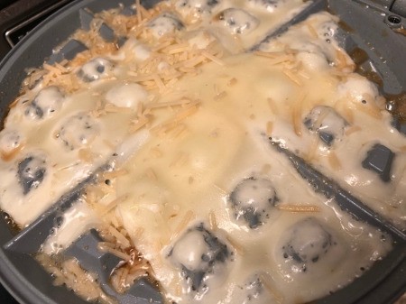 putting cheese in waffle iron