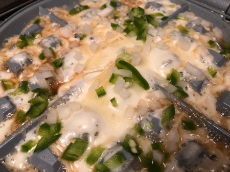 adding veggies to waffle iron