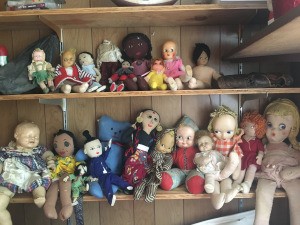 Identifying Old Dolls - a variety of old dolls on a shelf