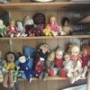 Identifying Old Dolls - a variety of old dolls on a shelf