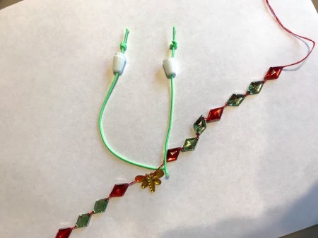 Kid Safe Acrylic Gem Necklace - cut two pieces of elastic, thread through safety clasp and knot ends