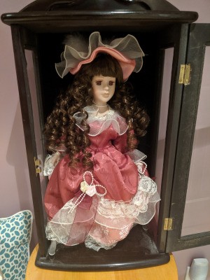 Identifying an Ashley Bell Doll - doll in display box, she has long ringlets and a salmon colored dress with matching hat