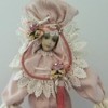 Value of Show Stoppers Porcelain Dolls - doll wearing an elaborate pink dress and headpiece