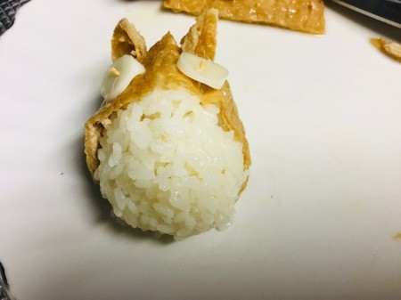 Totoro Inari Sushi Edible Craft - roll rice flavored with vinegar, sugar, and salt into a ball, press into the tofu pocket, add ears, and cheese eyesballs
