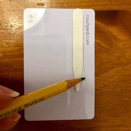 DIY Shirt Collar Stays from Magnetic Hotel Keys - use a pencil to trace around the stay