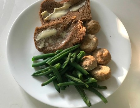 siced bread with dinner on plate