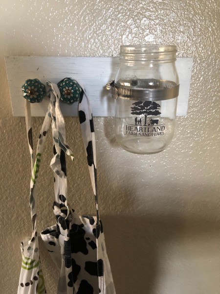 DIY Apron and Utensils Holder - apron straps and jar in place