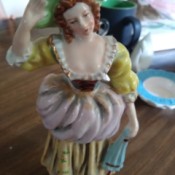 Identifying a Vintage Figurine - figurine of a woman dressed in perhaps Colonial attire