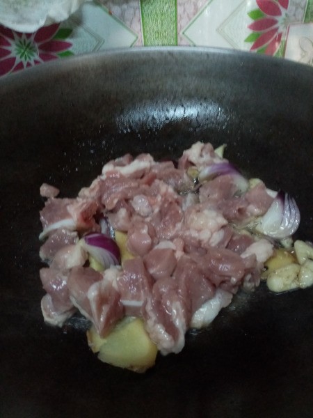 pork pieces added to pan