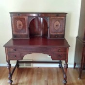 Value of an Antique Lady's Writing Desk - inlay desk with alcove, side storage and small drawers plus a long front drawer and two more little ones