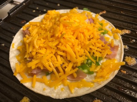 cheese, ham & peppers on tortilla