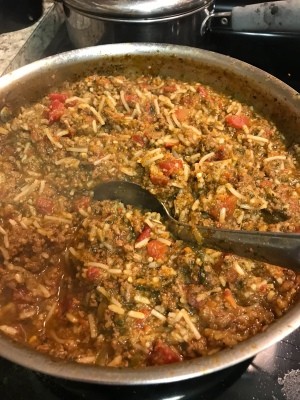 A pan of cooked ground beef filling.