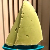 An avocado popsicle shaped like a boat.