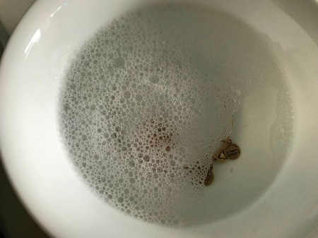 Restoring a Tarnished Gold Bracelet - add a drop of Dawn to water in a bowl and wash bracelet, use toothbrush if desired