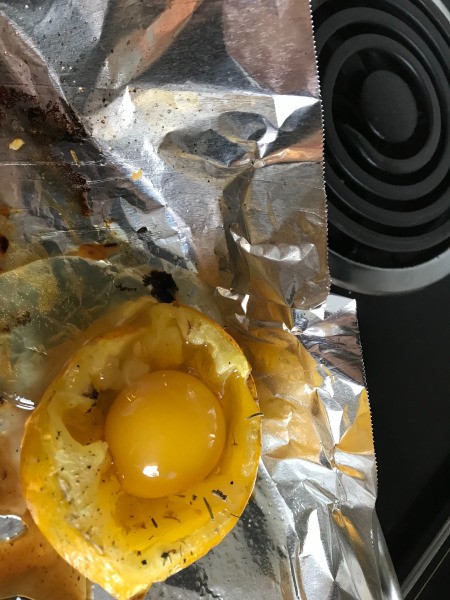 Egg dropped in baked Tomato