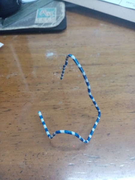 Making a Paper Clip Phone Stand - pull the standing tip backwards to provide support for the stand when the phone is resting there