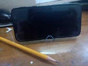 Making a Paper Clip Phone Stand - phone on stand with pencil next to it
