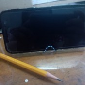 Making a Paper Clip Phone Stand - phone on stand with pencil next to it