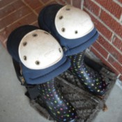 Knee pads on top of rubber boots for garden work.