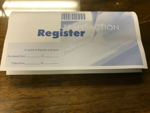 A check register on a table.