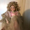 Identifying a Porcelain Doll - doll with a mass of blond ringlets and fancy dress
